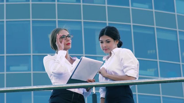 Attractive woman talking to her opponent and discussing their business plans