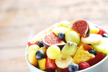 Fresh fruit salad on a brown wooden table