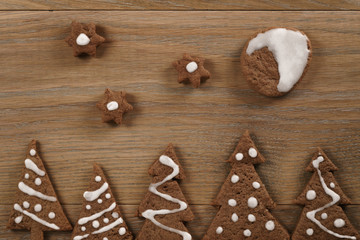 gingerbread chocolate cookies over wood table forms composition