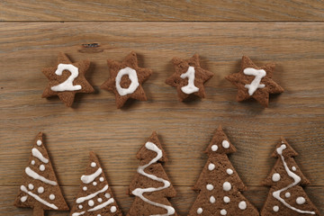gingerbread chocolate cookies over wood table forms composition