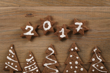 gingerbread chocolate cookies over wood table forms composition