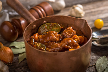 Homemade Goulash on wooden background