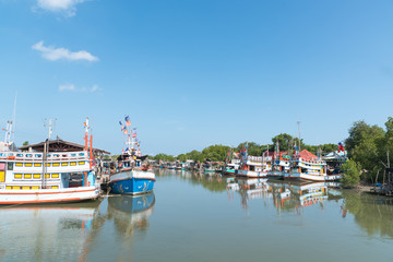 Typical Traditional Fishing Boats in a Harbour at Phetchaburi, Thailand and Blue Sky