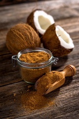 Coconut palm sugar on rustic wooden background