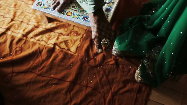 Woman puts ring on another woman's toe