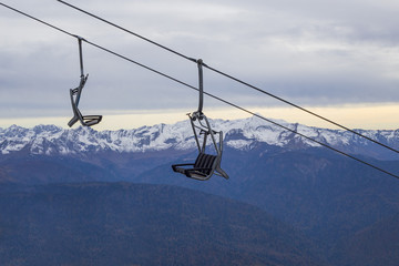 Open cabin of funicular in mountains at ski resort 