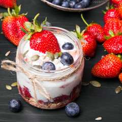 delicious dessert - yogurt with strawberries and blueberries