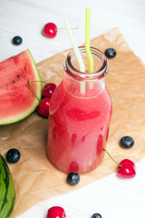 Fresh watermelon juice on a wooden background