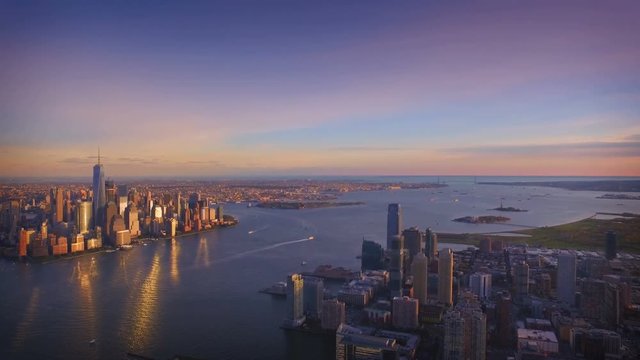 New York City evening aerial footage of lower Manhattan with Jersey City in foreground.
