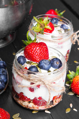 delicious dessert - yogurt with strawberries and blueberries
