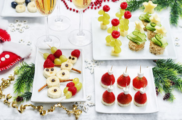 Assortment of New Year's snacks and a glass of champagne