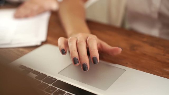 Stylish women's hand on the touchpad computer. teamwork. skype