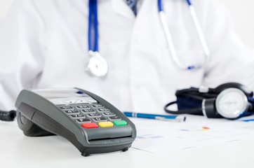 Payment terminal in doctor's office. Pay for health care