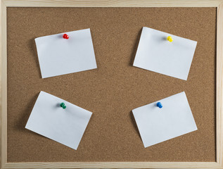 Thumbtack and note on corkboard