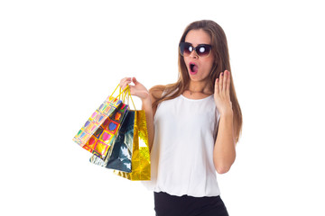Woman in sunglasses with shopping bags