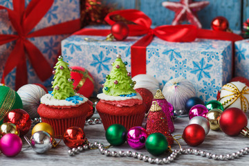 Fototapeta na wymiar Christmas cupcake with colored decorations