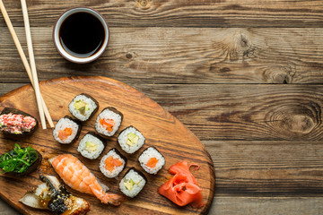 Sushi and rolls set with crossed sticks