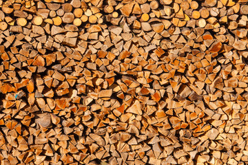 Piled split forest wood logs renewable heat energy