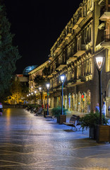 Fototapeta na wymiar Nizami Street with bright night illumination. Shopping center of Baku.
