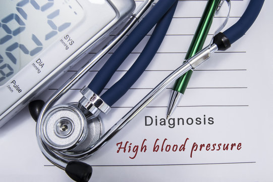 Diagnosis High blood pressure. Stethoscope and electronic sphygmomanometer lie on medical paper form with cardiac diagnosis High blood pressure related to group hypertensive diseases