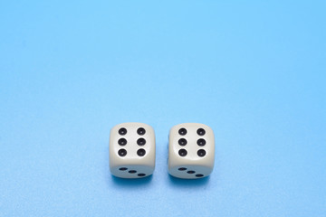 two dice double six on a blue background. Free space for text.
