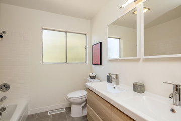 Fototapeta na wymiar Beige Bathroom with large mirrors, interior and modern bathroom.