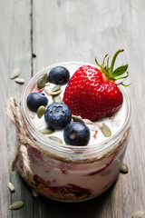 delicious dessert - yogurt with strawberries and blueberries