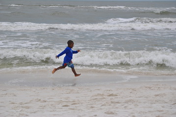 Child Running on the Beach