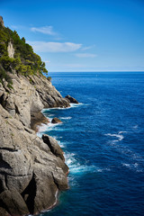 Wild coast behind Portofino in Italy / Rocky cliffs in Liguria
