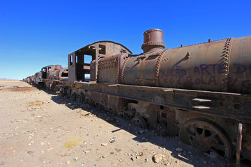 Fototapeta na wymiar Graveyard of rusty old trains in the desert of Uyuni, Bolivia