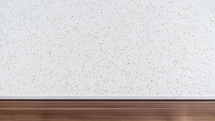 Closeup shot of white granite countertop over brown wooden kitch