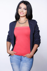 Casual dressed young woman stduio