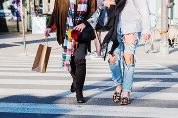 shopping women crossing a street
