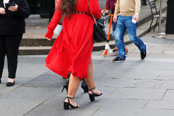 Fototapeta na wymiar woman with red dress in the city