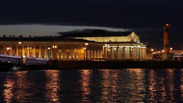 Russia, Saint-Petersburg, 28 March 2016: Night view of Old Stock Exchange Building and water area of Neva River at sunset, reflections, Birzhevoy, Dvorcovy, Palace bridge, Rastralnye columns