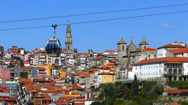 PORTO PORTUGAL, MARCH 2015. Old colorful houses in old part of Porto and cable car over Douro river.4K