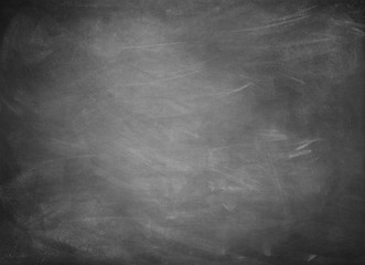 Chalk rubbed out on black board chalkboard texture background