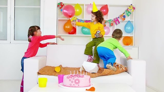 A group of children at a birthday party.slow motion, high speed camera