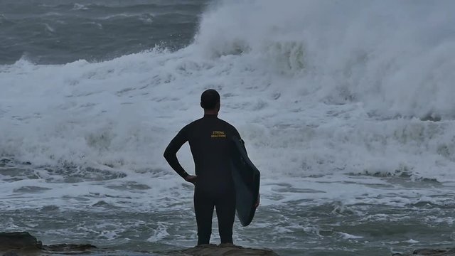 NSW, AUSTRALIA - JUNE 2016: bodyboarder surfer storm sea swells white wash