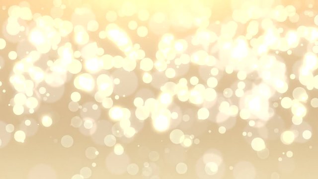 Falling, light gold holiday bokeh for use as a Christmas background or other seasonal design elements. Video is looped for buyer convenience.