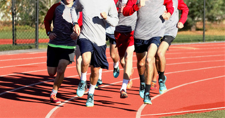 Fototapeta premium Boys group running on a track