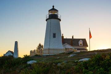 Pemaquid Lighthouse in Bristol Maine at sunset on a clear day
