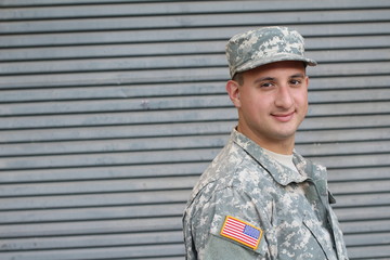 Young soldier with friendly healthy expression 