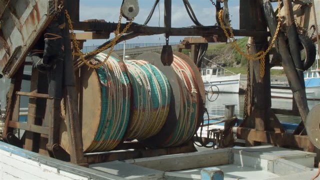 Commercial Fishing Boat with nets in harbour