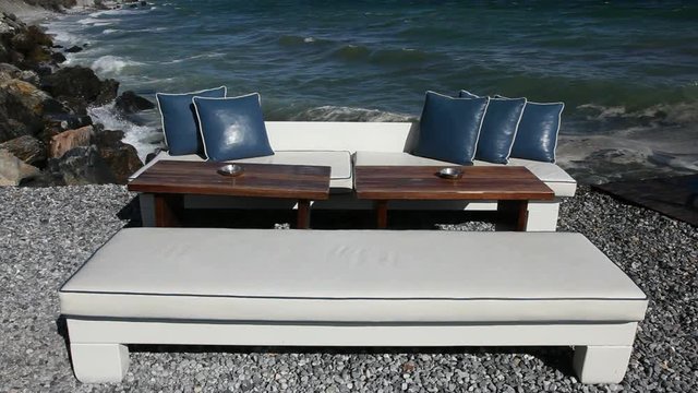 External Cafe terrace on the beach with table and chairs.Cafe is located in Greece in Platamonas.