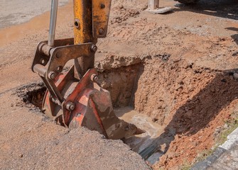 Fototapeta premium Excavator working on the Repair of pipe water 