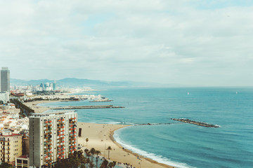 Wide view of city, beach and sea in Barcelona, Spain