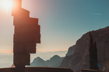 View of stone monument and morning Montserrat mountains