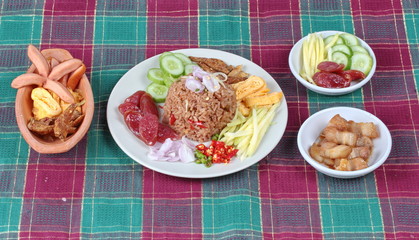 Fried sausage served with fried jasmine rice with shrimp paste,(Kao Klok Kapi)  set as green mango roll,Chinese sausage,crispy dried fish,shrimp,chili,shallot,sweet pork,cucumber and scrambled egg .