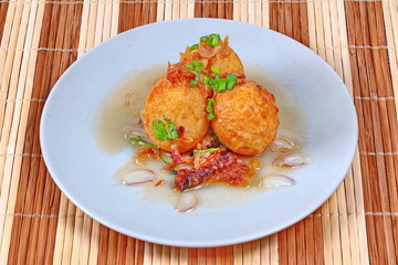 Fried hard-boiled eggs with tamarind sauce call as Khai Luk Keoi in Thai ,which mean egg gift  from son-in-law , is tasty as sweet sour and little spicy topped crispy skin of boiled egg. 
